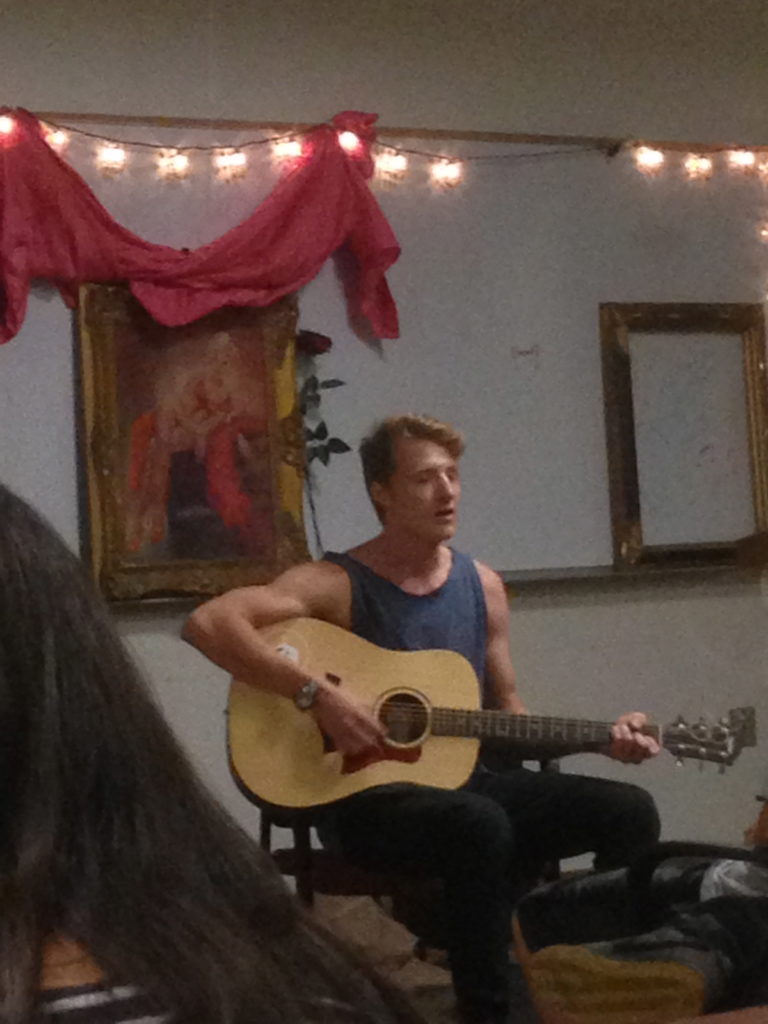 Josh Jenkinson playing acoustic and singing
