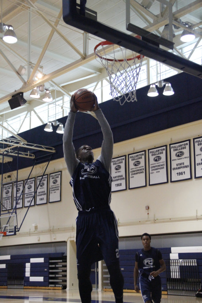 Joel Brokenbrough goes up for a dunk at the Hornets practice.Photo credit: Greg Diaz