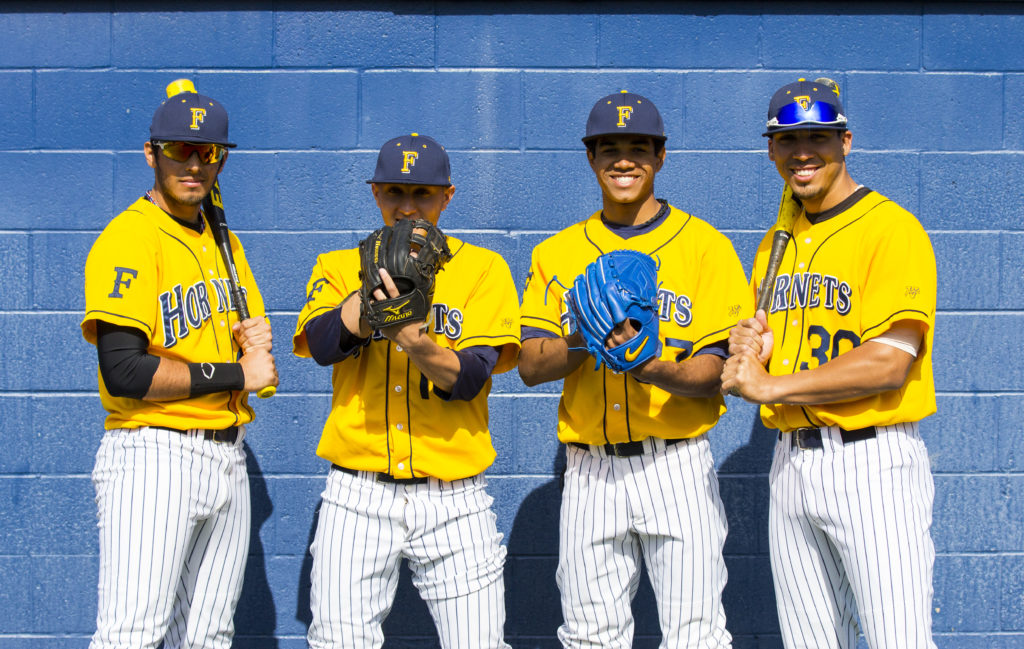 Oscar Heredia, Christiannel Cosme, Axel Cruz and Ismael Sanchez (left to right) look to shine for the Hornets on the baseball diamond and get noticed by professional scouts.Photo credit: Mathew Flores