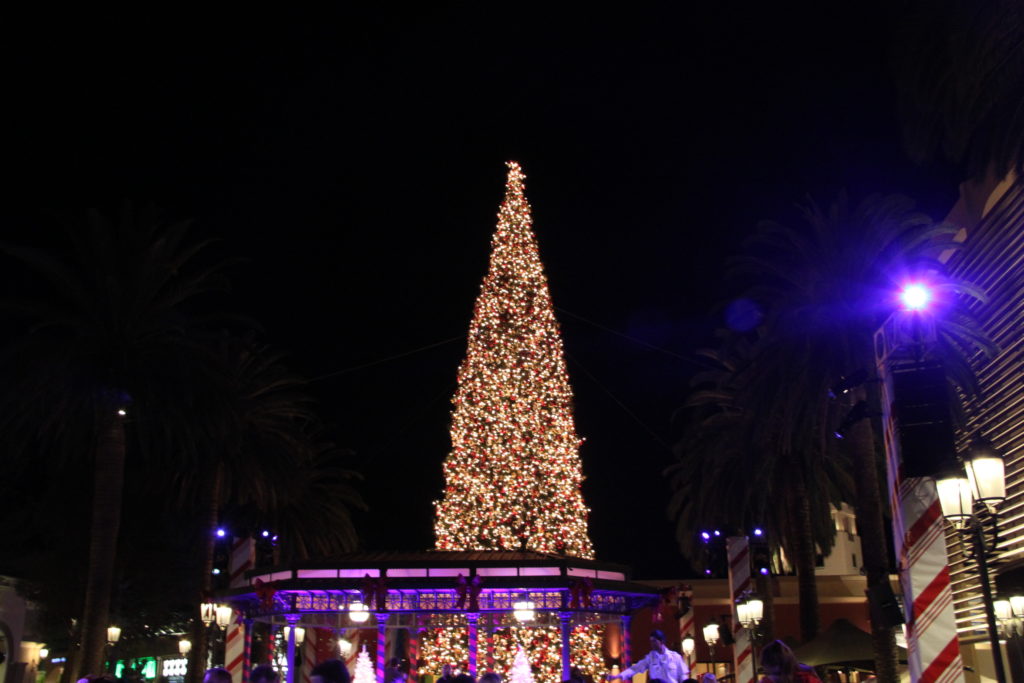 The 90-foot Christmas tree decked in lights and ornaments, towering over the courtyard. Photo credit: Hetty La