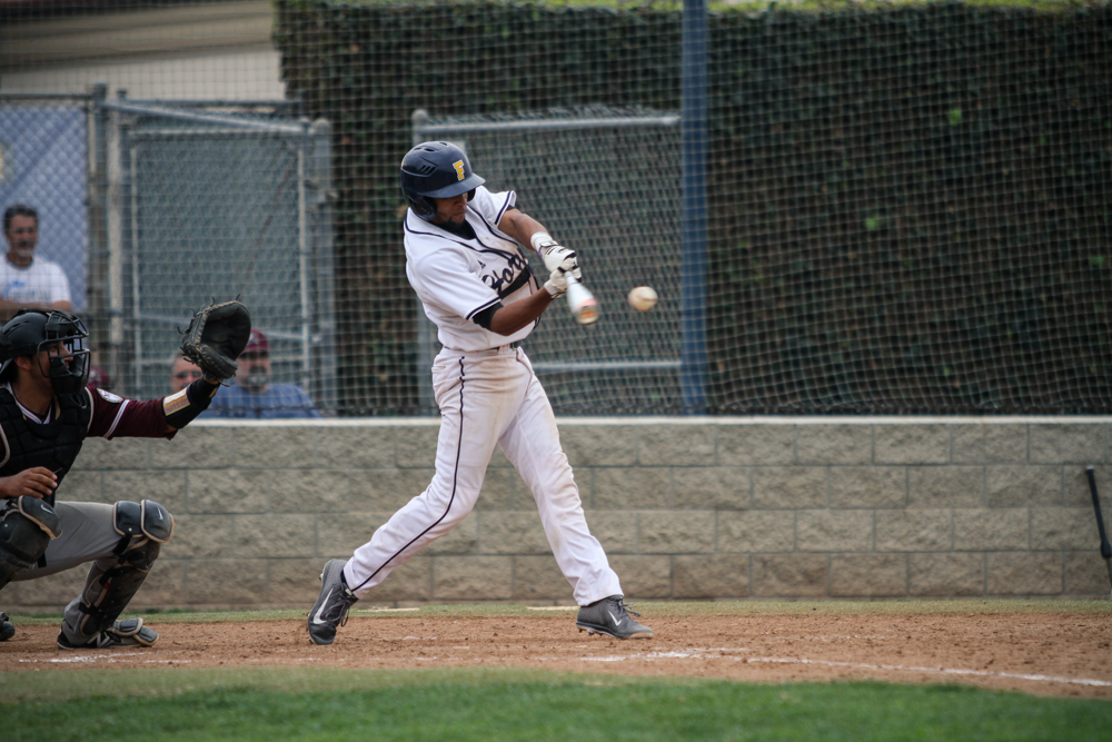 Julio Rivera delivering game winning hit against Mt. SAC on Saturday. The Hornets defeated the Mounties 6-5 in 10 innings.  - Image credit, Ricardo Zapata