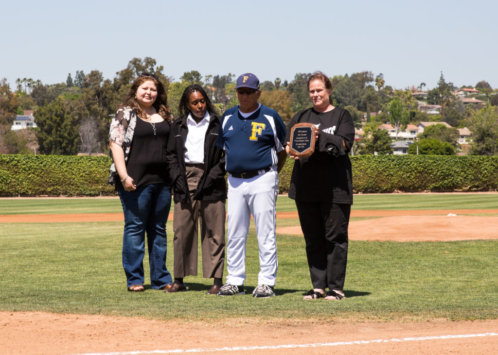 Coach Nicholas Fuscardo accepts an award for his work with Take Back the Night before the Hornets square off against Santa  Ana Photo credit: Christian Fletcher