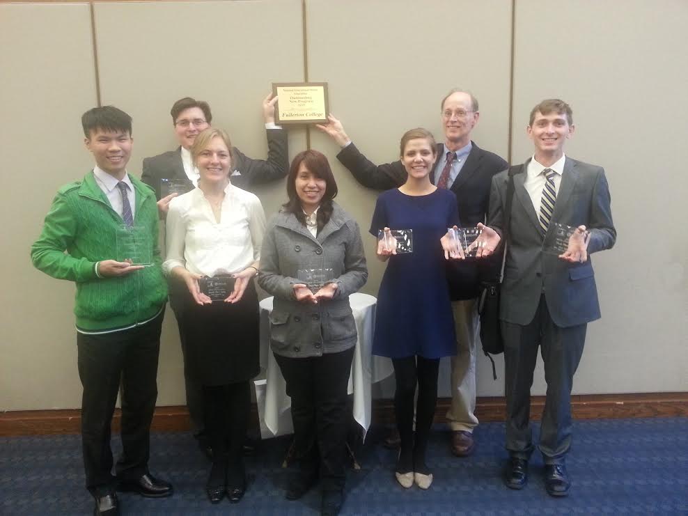 The Forensics Team holds their awards after competing at the National Educational Debate Associations national championship at Dayton Ohio.  
Image credit | Doug Kresse