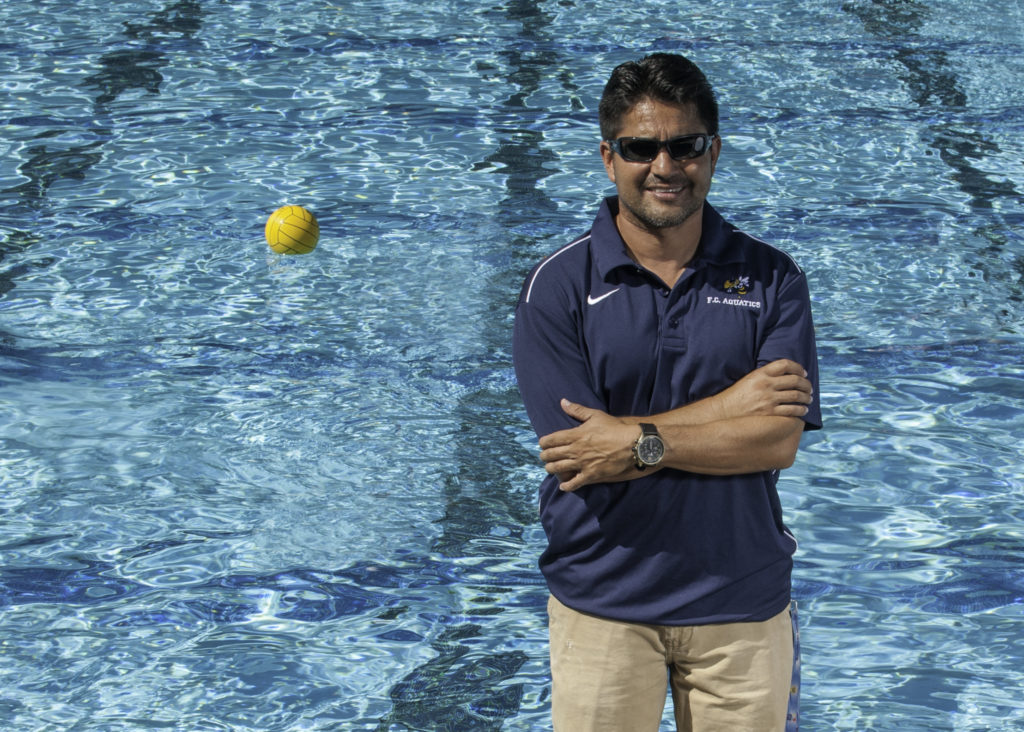 Womens water polo head coach Gabriel Martinez at the FC pool deck getting ready for another Thursday morning practice. Photo credit: Patrick Quirk