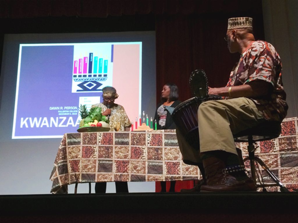 Beatrice Jones and Janae Price presented in detail the meaning behind the seven principles of Kwanzaa while drummer John Beatty played traditional West African rhythms on stage. Photo credit: Christina Nguyen