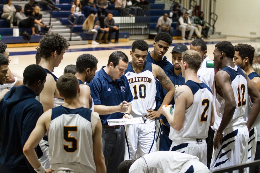 Head Coach Perry Webster goes over strategy with team. Photo credit: Patrick Quirk