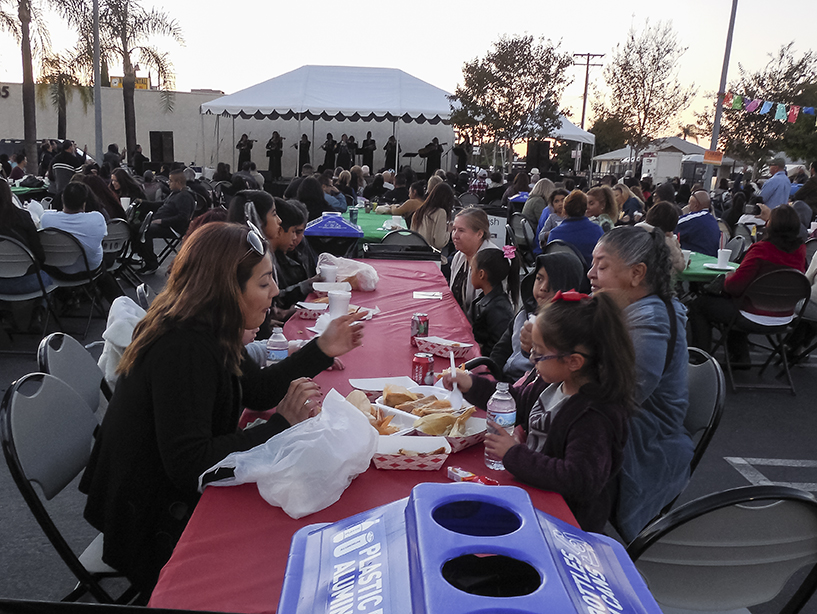 The community  enjoying some delicious tamales and some great music at the Tamale Festival in La Habra, Ca on Nov. 29, 2015 Photo credit: Neddie Facio