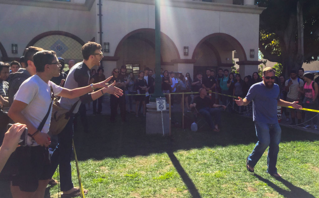 Fullerton College students Jeremiah Price and Alex Stanley call out a visiting christian evangelist, Christian, in hopes to shut him down on Wednesday Feb. 10 Photo credit: Morgan Mayfield