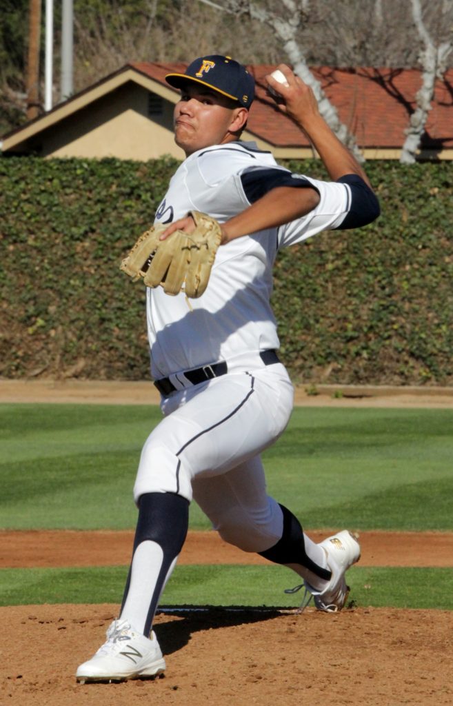 Hornets pitcher Randall Ortiz during his complete game shut out at Fullerton College home opener on Thursday. Photo credit: Kim Cisneros