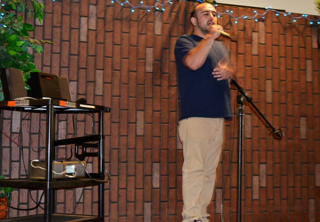 Michael Phillip Perez, was the first of 12 performers to hit the stage and showcase his lyrical skills on Open Mic Night at the Cadena Cultural Center Tuesday, Feb. 23. Photo credit: Jason Burch