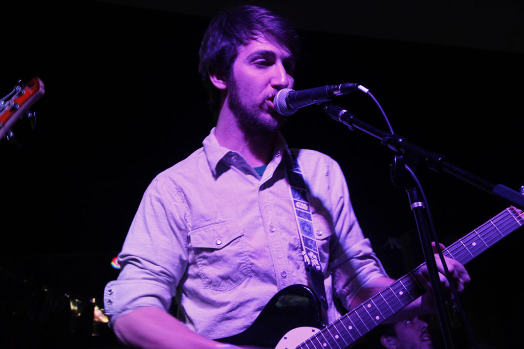 Cameron Hallenbeck, vocalist and guitarist for Comrade Cat, performing at Out of the Park Pizza. Photo credit: Amber Vaughn
