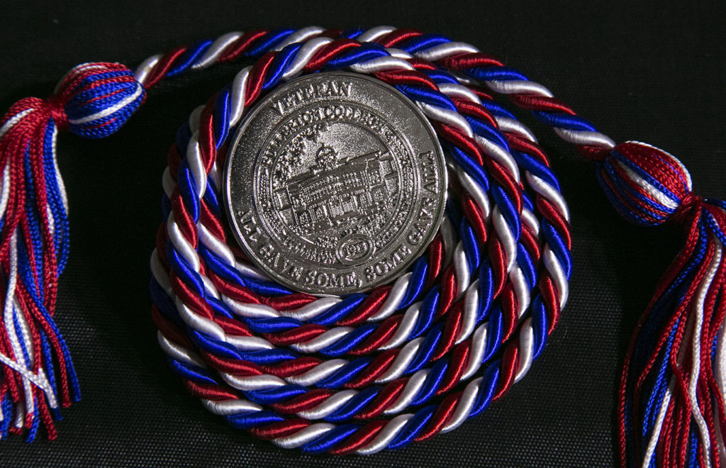 Fullerton Collage Veterans coin and Graduation ribbon. Photo credit: Christian Mesaros