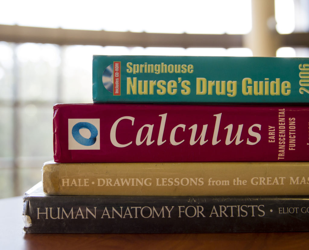 Some books you would commonly find in a students bag at Fullerton College. Photo credit: Joshua Miranda