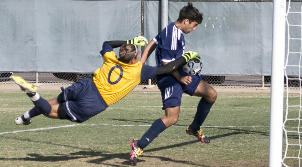 Andre Prado #12 follows through on his break away, and comes out with the score Photo credit: Christian Mesaros