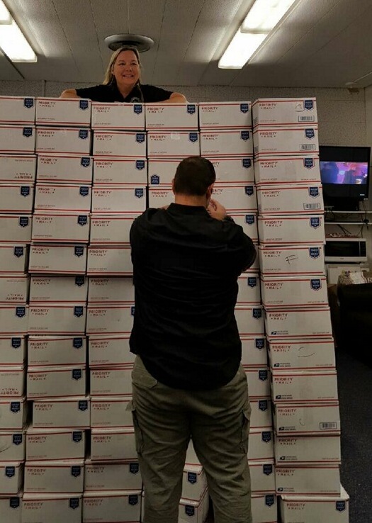 Tania McKeown, Certifying Official and Academic Counselor, Dr. Nick Arman
stand by care packages ready for shipment. Monday, November 23, 2015 Photo credit: VRC archive