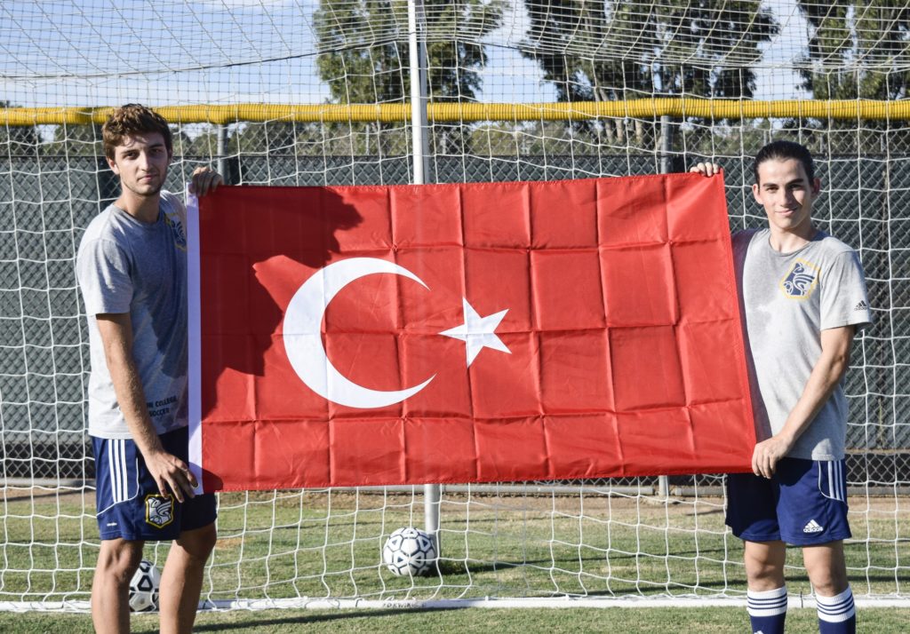 Ata Atakan and Edward Colakyan hold the Turkish flag with pride after soccer practice at Fullerton College on Monday Oct., 10 Photo credit: Neddie Facio