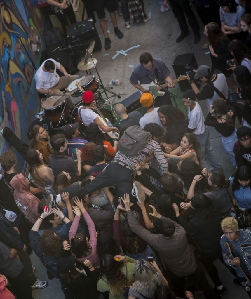A teenager crowd surfs during the band Espressos performance at Way Too Fun Fest. Photo credit: Joshua Miranda