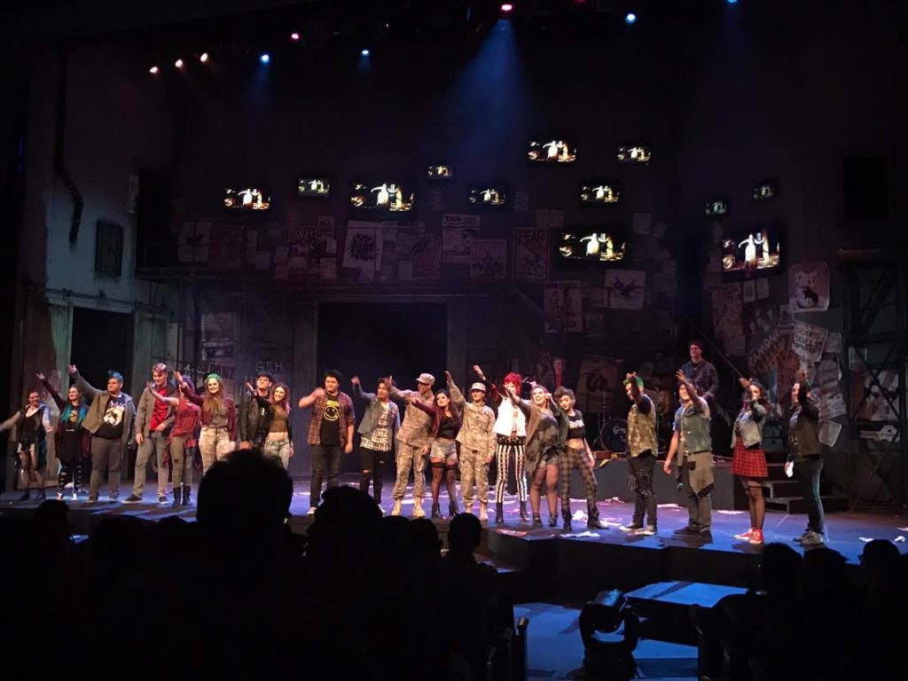 The cast of American Idiot give thanks to the audience at their curtain call. Photo credit: Hector Arzola