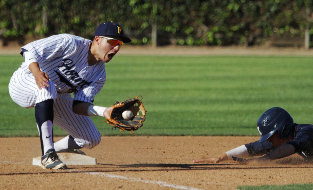 Andrew Aguilar ready at third base tagging a laser out off of a steal from second base. Photo credit: Bailey Long