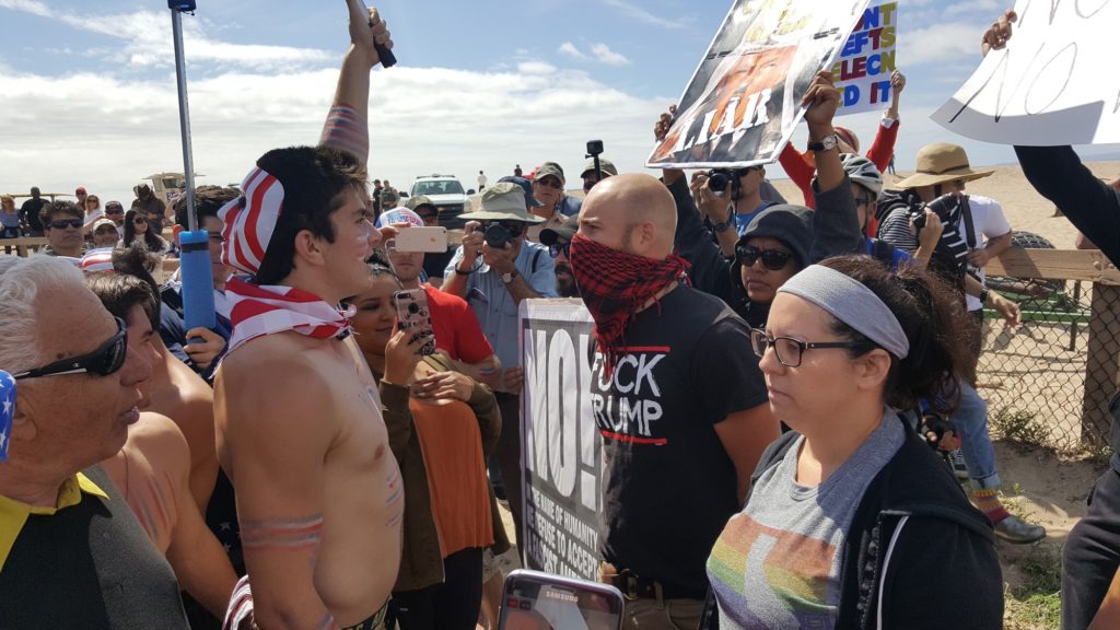 Trump supporters and protesters get face to face while debating their political ideals during the Make America Great Again march at Bolsa Chica State Beach on Saturday, March 25. Photo credit: Ayrton Lauw