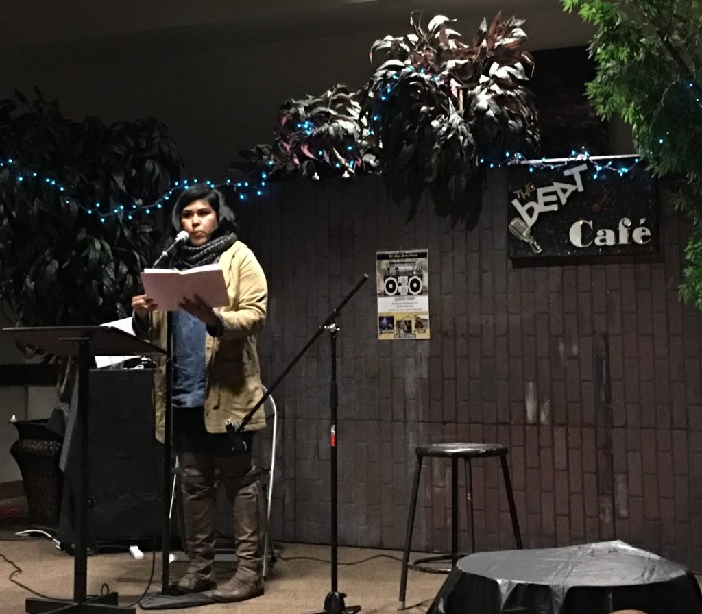 Gabriela Verdin Flores performing her poem, The Divided States of America Photo credit: Lann Nguyen