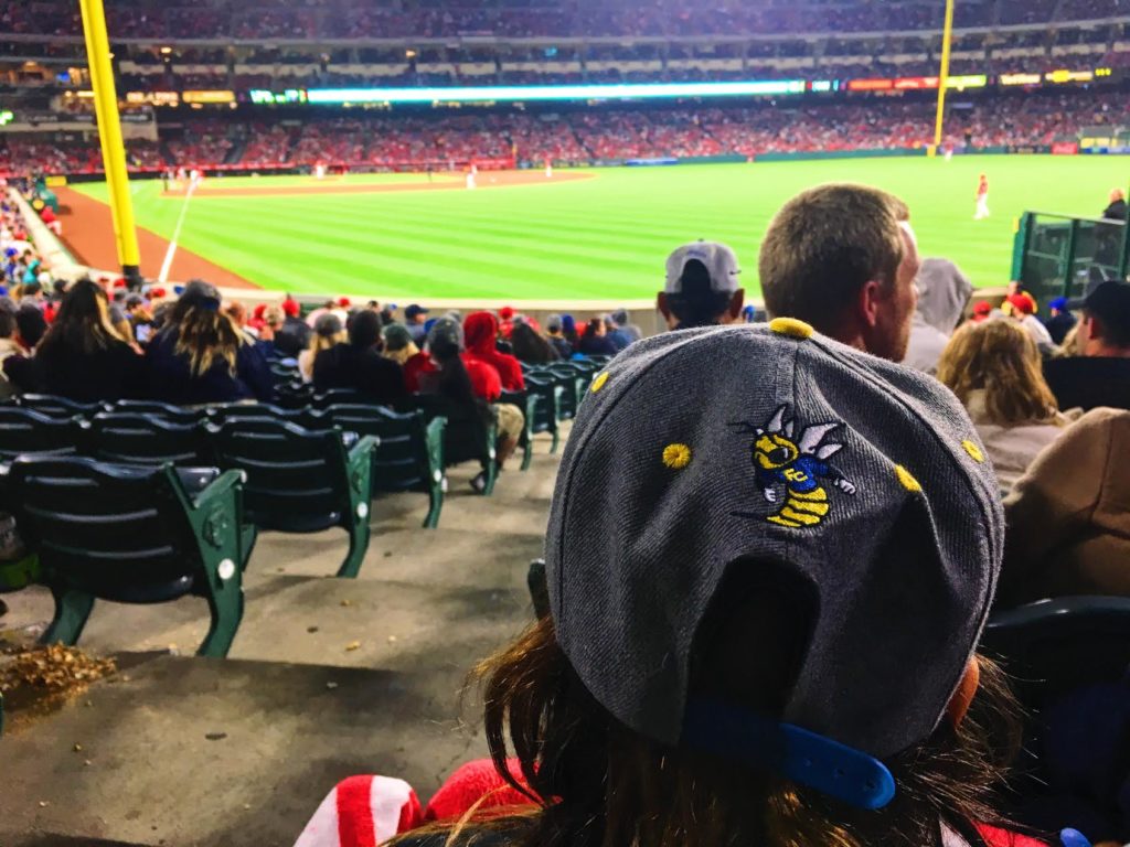 Fullerton College student rocking their custom made FC Angels baseball cap while watching the game. Photo credit: Stephanie Lozano