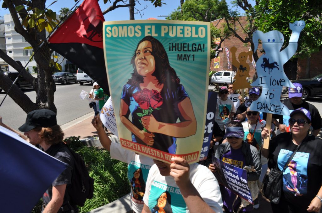 A marcher holding a sign translating to We are the people during the May Day march in Anaheim on Monday, May 1. Photo credit: Hector Arzola