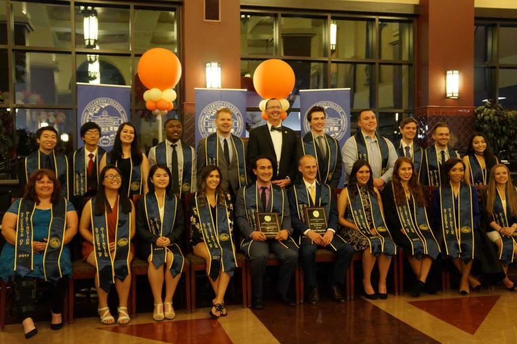The 20 Students of Distinction scholarship recipients take a group photo with Fullerton College President Greg Schulz. Photo credit: Aaron Untiveros