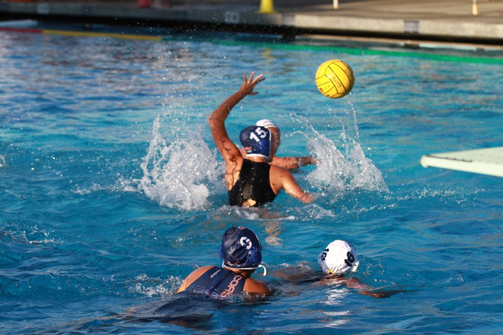 Freshman Cynthia Lujan races for the ball as she swims pass her defender. Photo credit: Tameka Poland