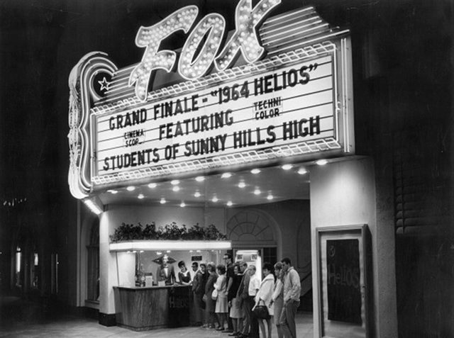 Movie goers stand in line for tickets as Fox Fullerton Theatre features 1964 Helios in technicolor and cinema scope.