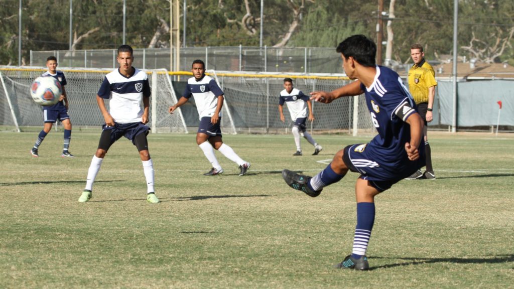 Number 16, Nick Davilla passes the ball to a teammate. Photo credit: Joshua Mejia