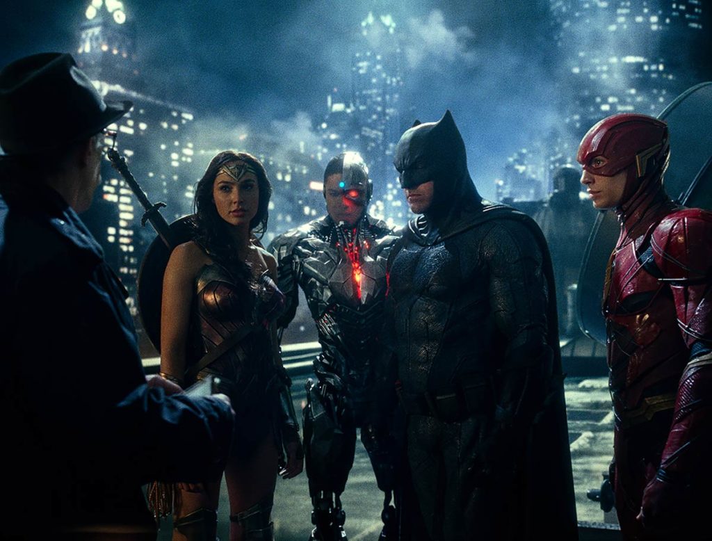 Wonder Woman, Cyborg, Batman, and The Flash meet with Commissioner Gordon on the rooftops of Gotham City Photo credit: Warner Bros. & Warner Bros.