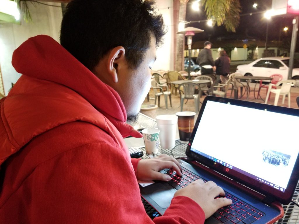 Chenyang Cui, an international student using the internet in order to finish his assignment. Photo credit: Ayrton Lauw