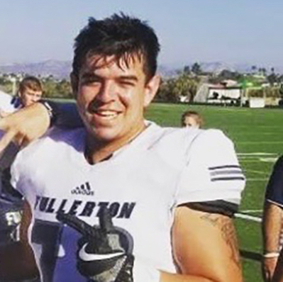 Fullerton College Hornet freshman Christian Yanos smiling after a team victory. Photo credit: Fullerton College