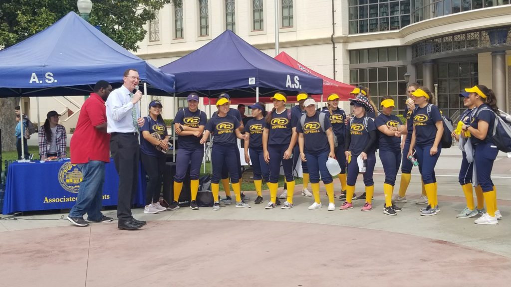 President Greg Schulz congratulating the girls softball team on their most recent win. Photo credit: Alejandra Malagon
