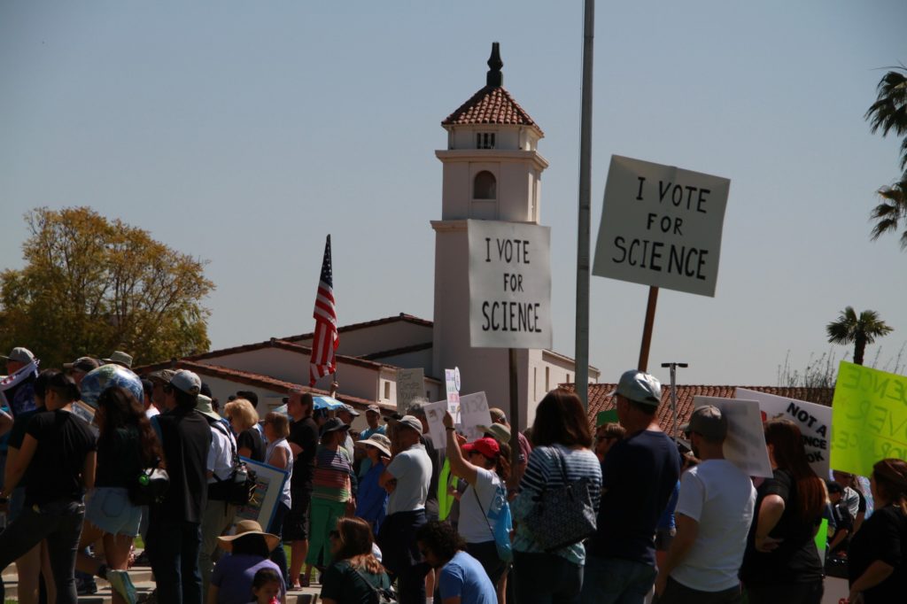 Community members gather to rally for evidence-based policies during the March for Science on April 14 in front of Fullerton City Hall. This is the second year that March for Science has taken place in Fullerton. Photo credit: Aaron Untiveros