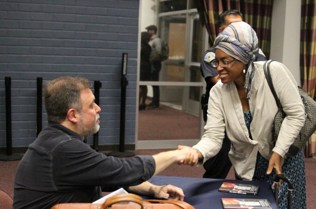 Tim Wise signs his books as he meets and greets fans following his speech at Fullerton College. Photo credit: Michelle Lobato