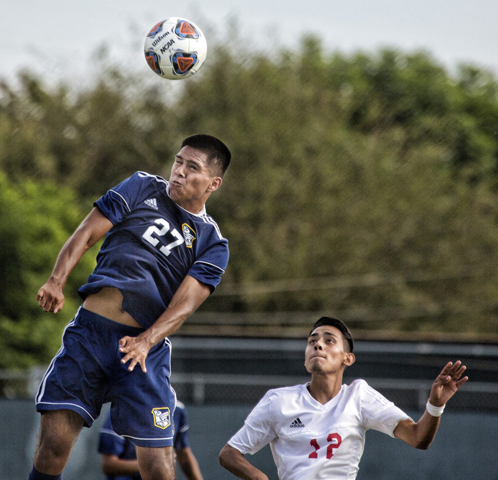 Freshman defender Nicacio Quinonez goes up for a header to gain ball possession over Imperial Valley College Monday, Oct. 1. Photo credit: Jim McCormack