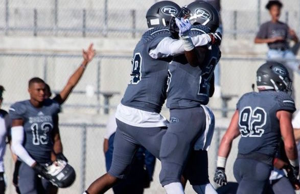 The Hornets celebrate a victory against Cerritos College Saturday, Oct. 13. Photo credit: Fullerton College Administration