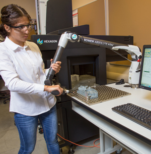 Fullerton College Metrology  student works with new Romer Absolute Arm equipment. Photo credit: Elizabeth Reyes,Quality Magazine
