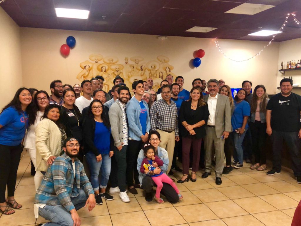 Quirk-Silva takes a photo with her husband, team, and local supporters in Fullerton after her speech thanking everyone for coming and supporting her. Photo credit: Rebecca Hiraheta
