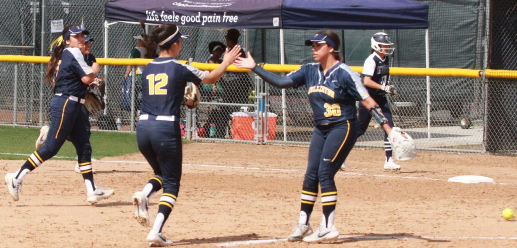 Hornet pitcher Jessica Lopez thanks Hornet infielder Sabrina Anguiano for making the throw from shortstop to get the last out of the inning against LA Mission on Saturday, Mar. 9. Photo credit: Bovie Lavong