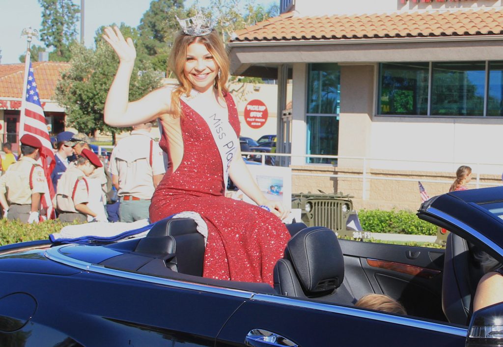 Miss Placentia 2019, Ashley Nelson waves as she waits in the parade staging area on the corner of Yorba Linda Blvd. and Kreamer Blvd. Photo credit: Gabe Larson