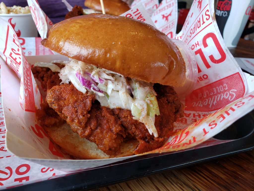 Clydes Original sandwich topped with chicken tenders, southern slaw and pickles. Photo credit: Ann Lipot