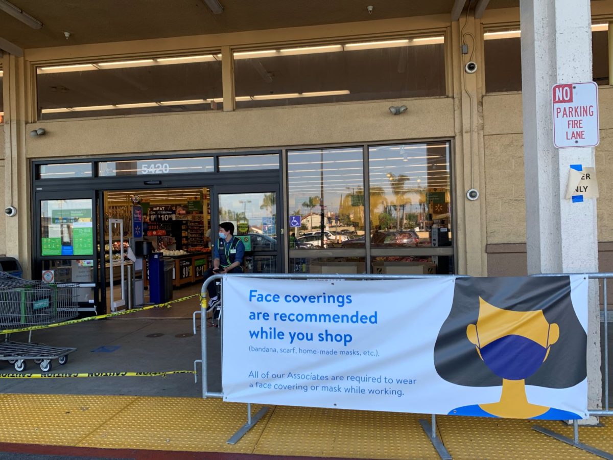  New Positions become a necessity as this worker’s job tracks the amount of people in the store. 

This worker’s position is to track the amount of people in the store, a technique used to monitor occupancy under Walmart’s new policies limiting occupants. 
(Photo Credit Aaron Velasquez)