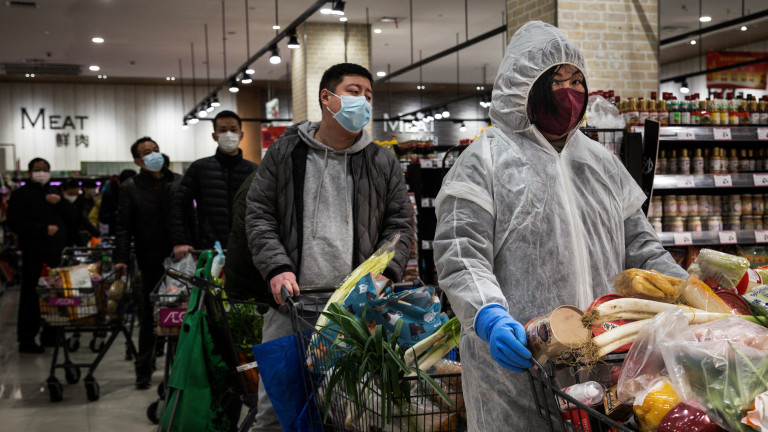 Shoppers in a Wuhan grocery store. Photo credit: Getty Images