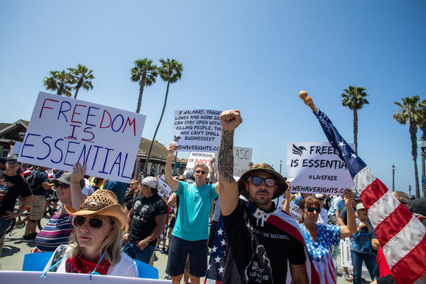 Protestors demand their freedom back in Huntington Beach. Photo credit: Apu Gomes