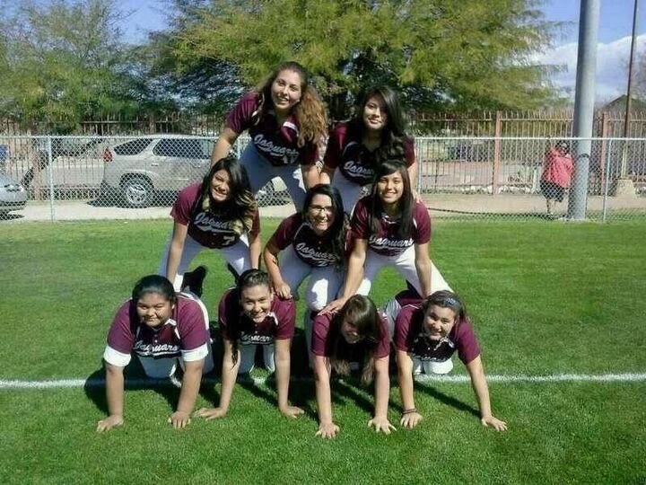 Nicole Hamilton (third girl at the bottom) taking team photos, Desert View High Schools Junior Varsity team. 