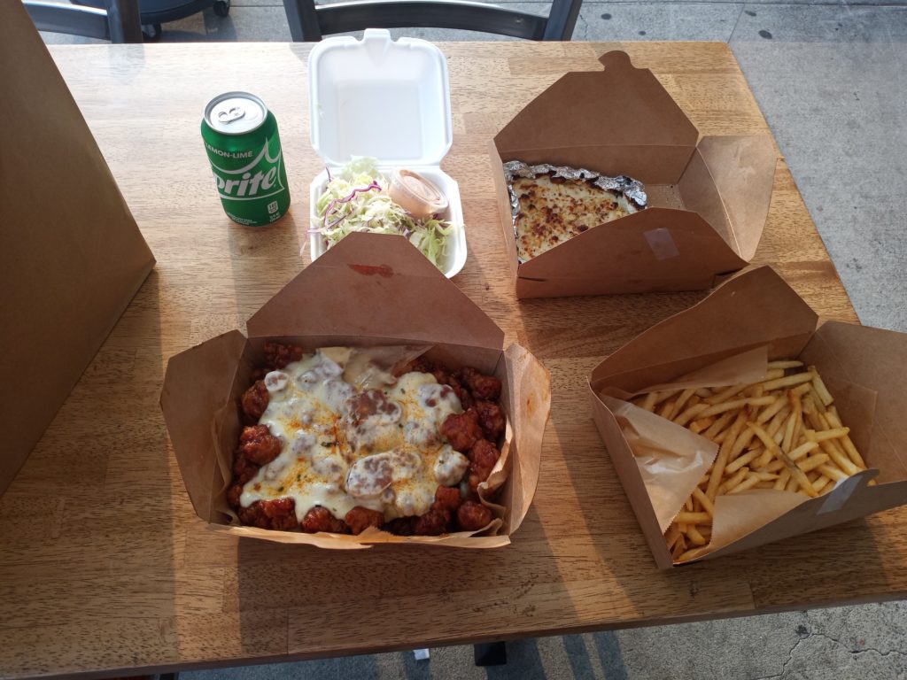 The entire order from Chicken University, at one of their patio tables. Photo credit: Crystal Bender