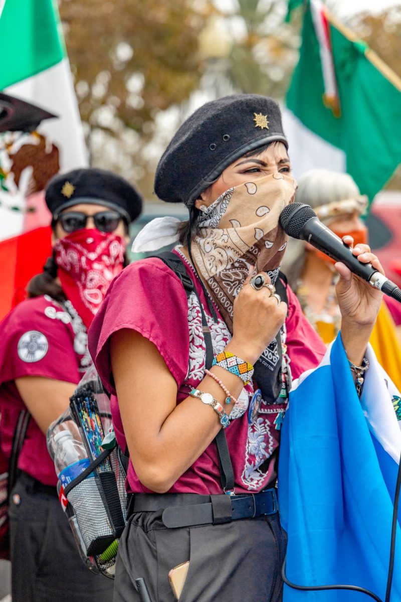 Ivette Boyzo Speaking to the crowd before they march